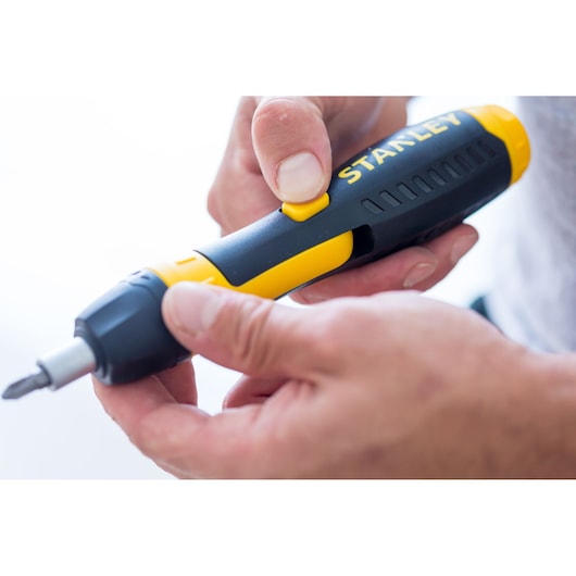 STANLEY 0-63-038 black and yellow screwdriver held in hand, close-up side photography.