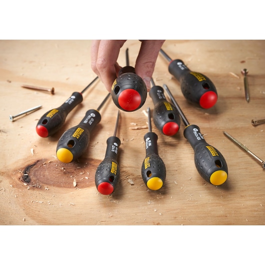 STANLEY 0-65-437 screwdrivers set with black handles and yellow or red ends on wood surface, top view.