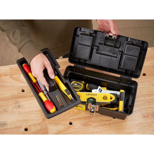STANLEY 1-92-064 tool box open on table, showing tray with tools and interior compartment.