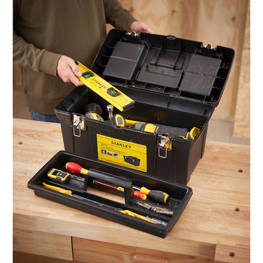 STANLEY 1-92-066 toolbox in photography, open showing assorted hand tools on a wooden workbench.