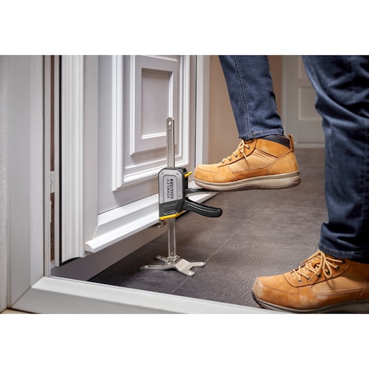 STANLEY FATMAX TradeLift Application Image. Door Installation Using Foot. 