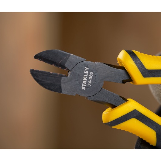 STANLEY STHT0-74455 diagonal cutting pliers with black jaws and yellow and black grips in close-up.